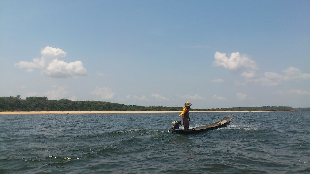 Fisherman on a boat in the Arapiuns river