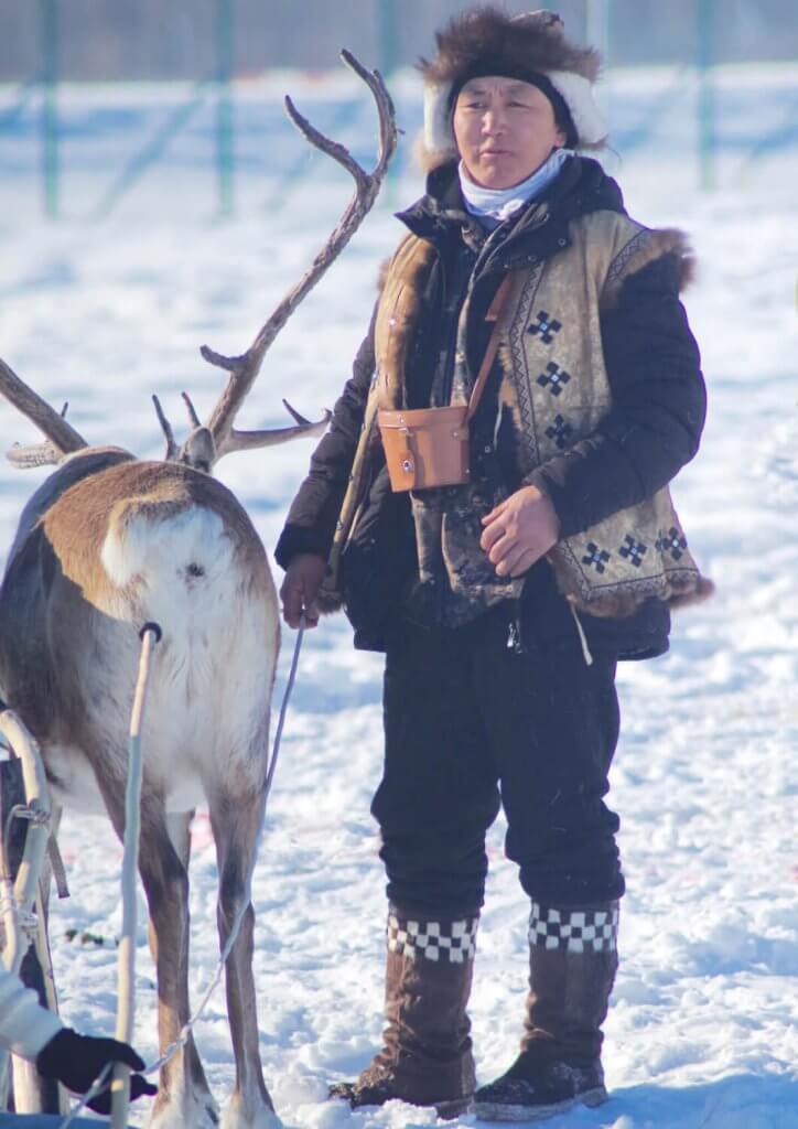 Afonia wearing an Eveny traditional competition suit during a reindeer festival