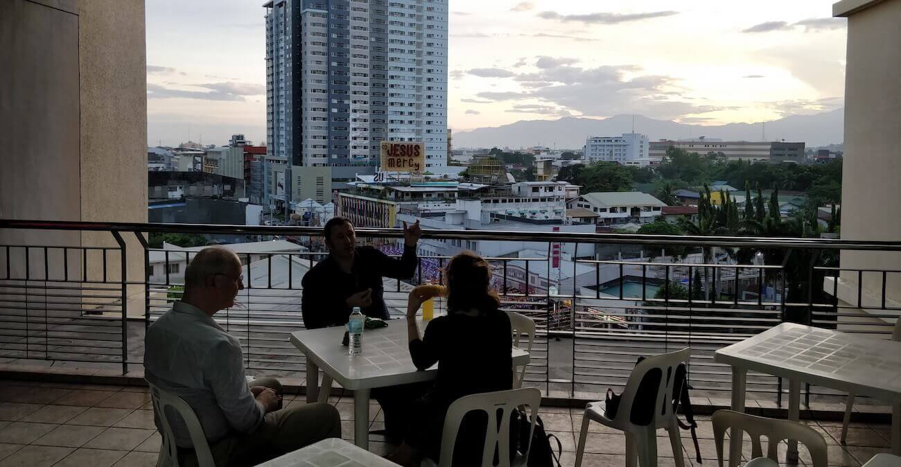 Colleagues discussing research outputs at a conference