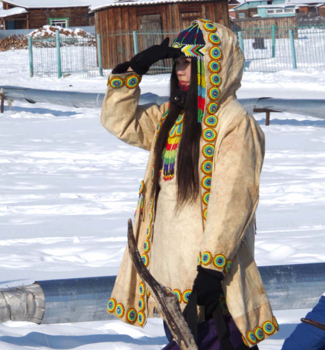 Even-girl dressed in a colorful handmade suit
