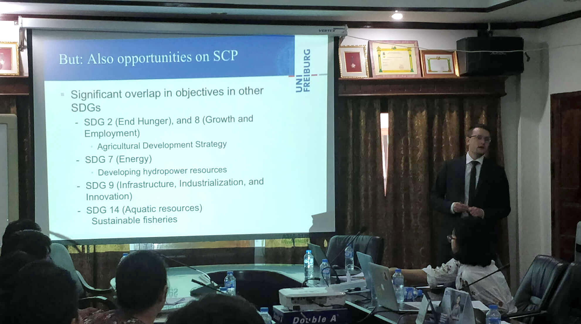 Presenting results of a study at the Laotian Ministry of Planning