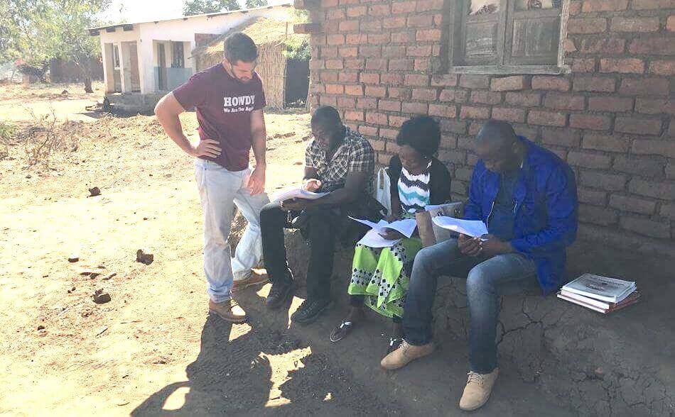 Mixed Methods research: Timothy calibrating the survey instrument with enumerators in Malawi
